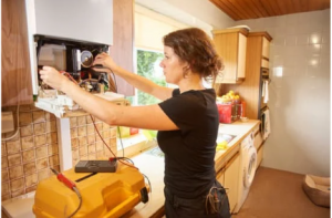 woman installing boiler