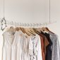 different types of blouses hanging in line